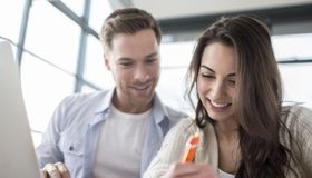 Couple paying bills online