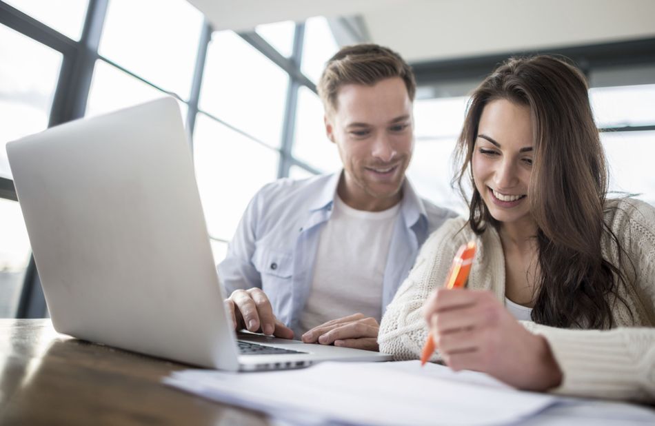 Couple paying bills online